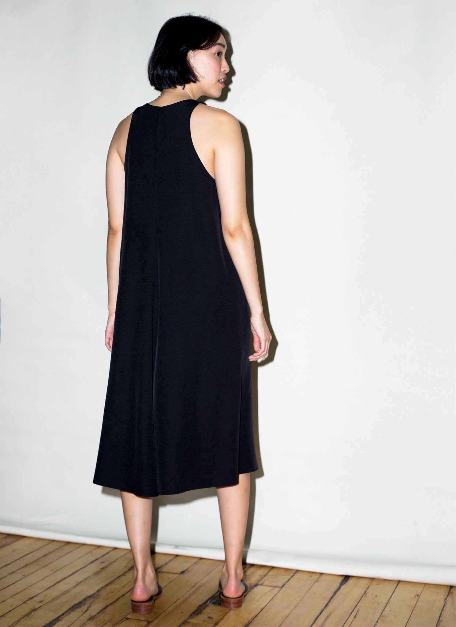 black silk sleeveless dress Enza Costa Silk Knit Sleeveless Twist Midi Dress in Black
